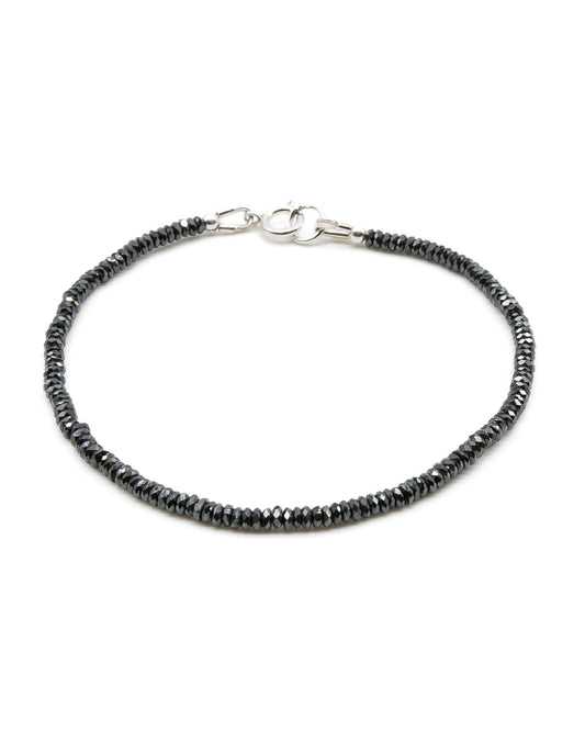 Dainty faceted black hematite beaded gemstone bracelet with sterling silver spring ring clasp.