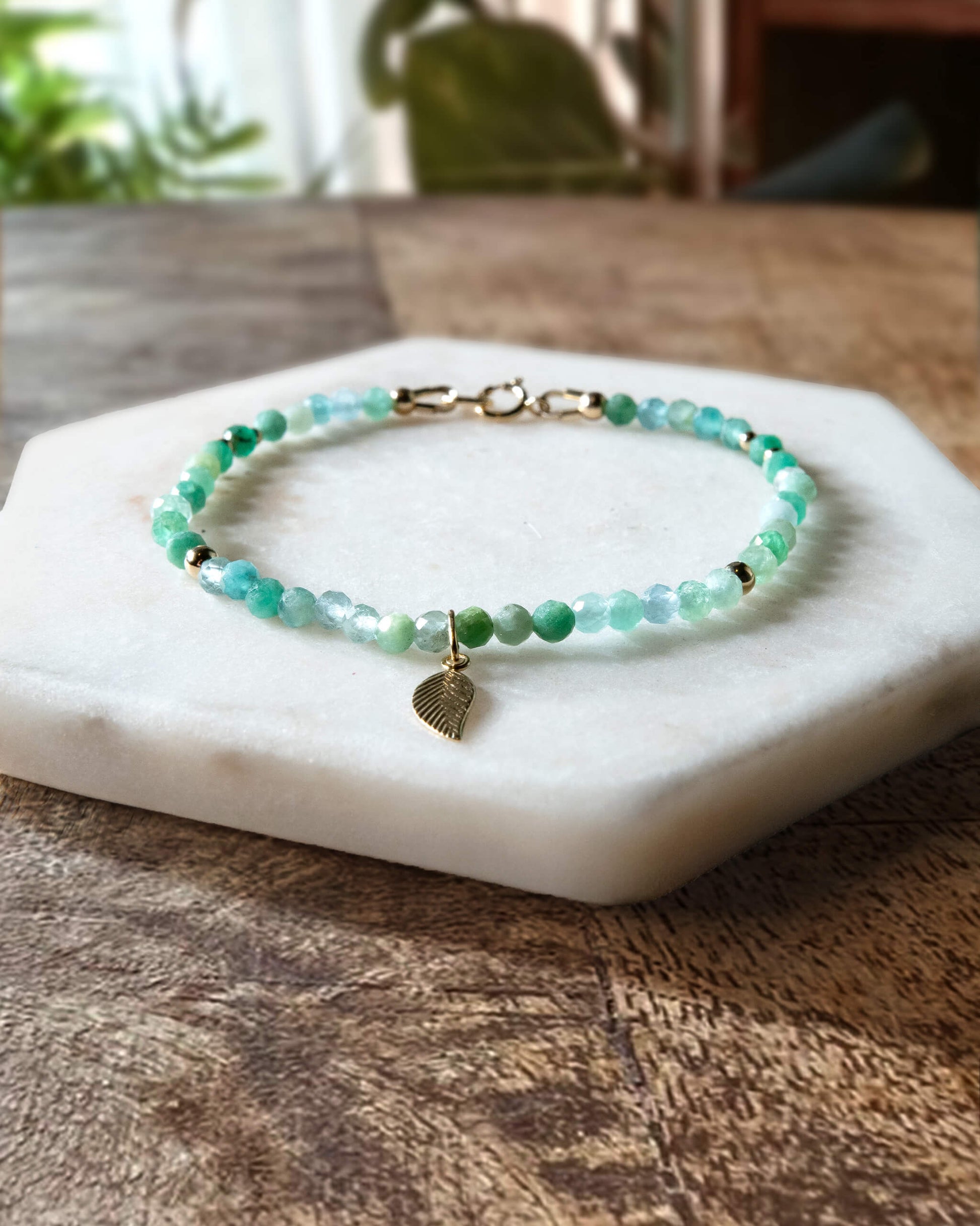 Green chrysoprase gemstone bracelet with 14k gold-filled leaf-shaped charm and spring ring clasp.