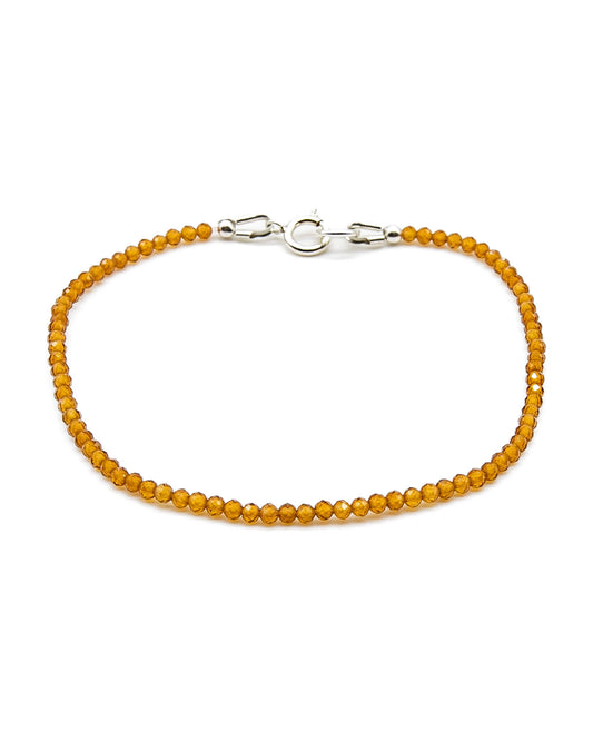 Dainty orange citrine beaded gemstone bracelet with sterling silver spring ring clasp.