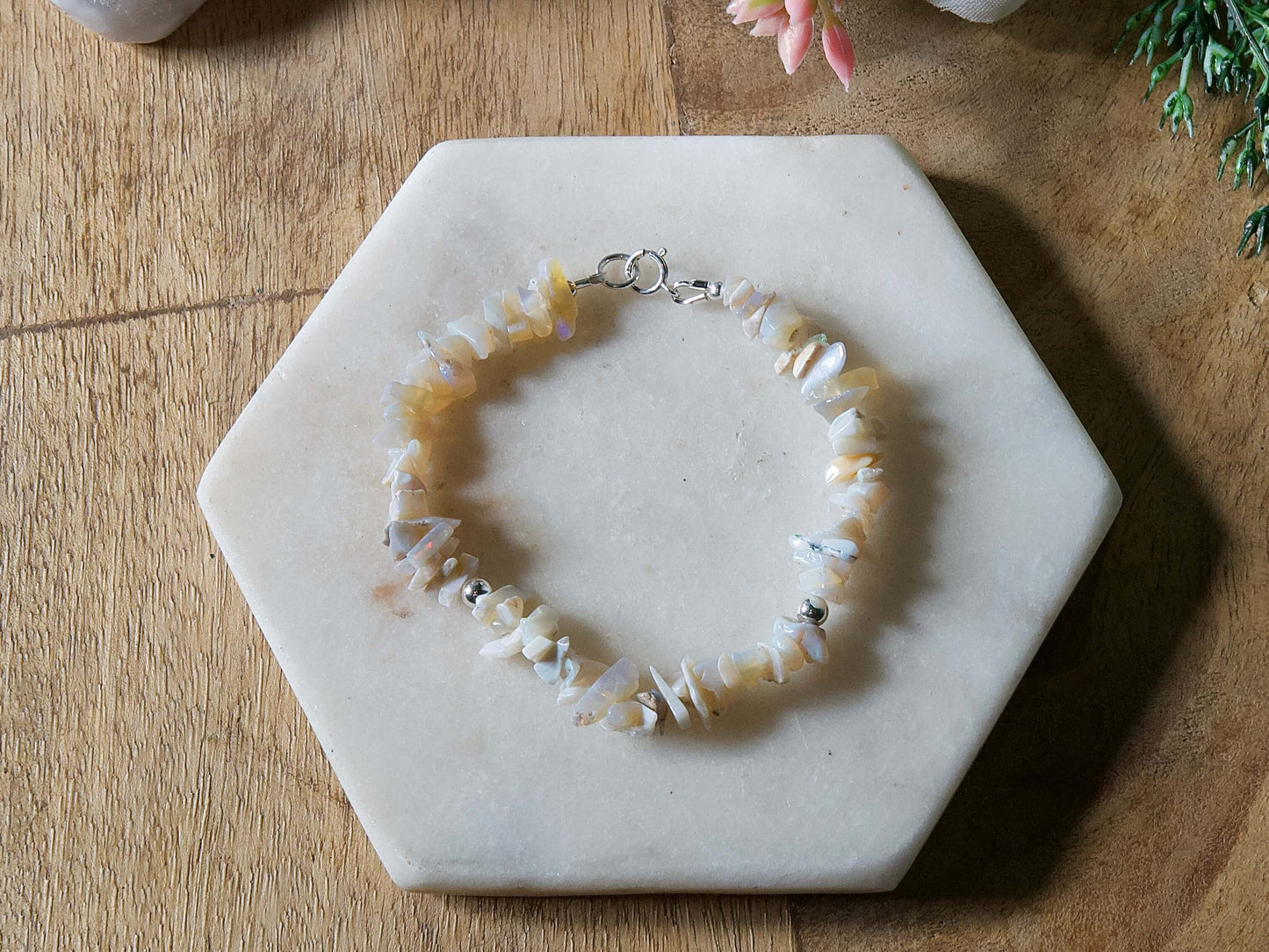 Pale off-white and grey opal chip gemstone beaded bracelet with sterling silver accent beads and spring ring clasp.