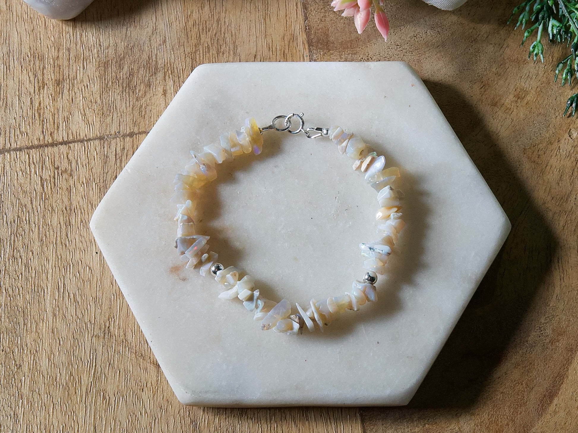 Pale off-white and grey opal chip gemstone beaded bracelet with sterling silver accent beads and spring ring clasp.
