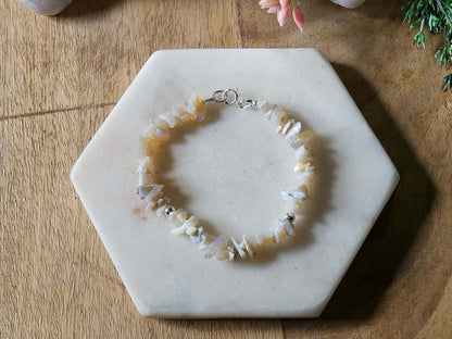 Pale off-white and grey opal chip gemstone beaded bracelet with sterling silver accent beads and spring ring clasp.