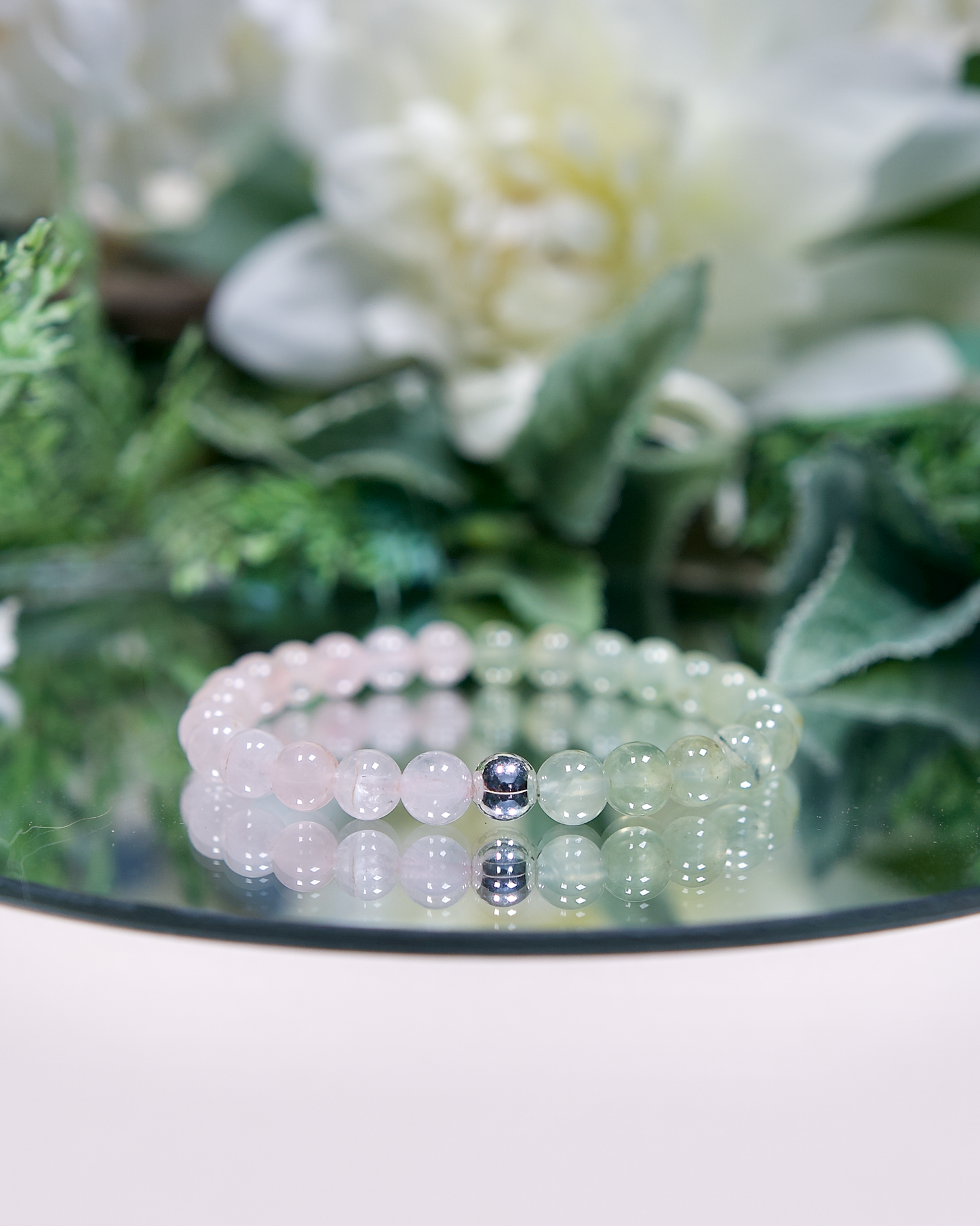 Close up of Heart Sanctuary bracelet with 6mm pink Rose Quartz and pale green Prehnite beads