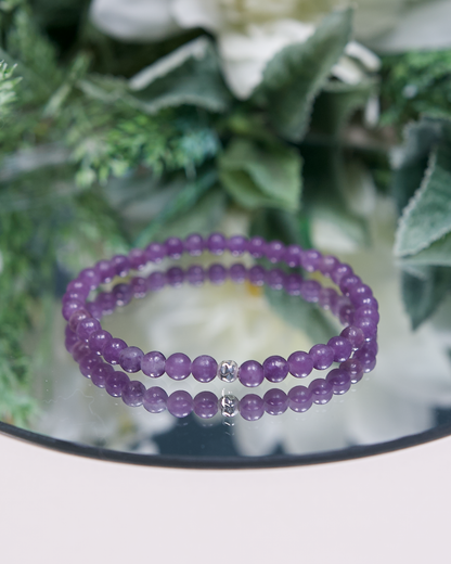 Lavender purple Lepidolite beaded bracelet with smooth round beads and a hammered sterling silver accent bead on mirrored plate