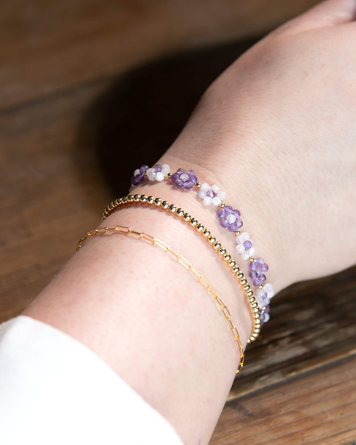 Dark and light purple amethyst beaded daisy chain bracelet with 14k gold-filled accents and spring ring clasp.