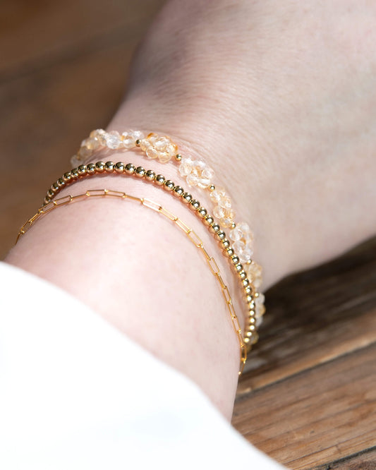 Light and bright yellow Citrine beaded daisy chain bracelet with 14k gold-filled accents and spring ring clasp.