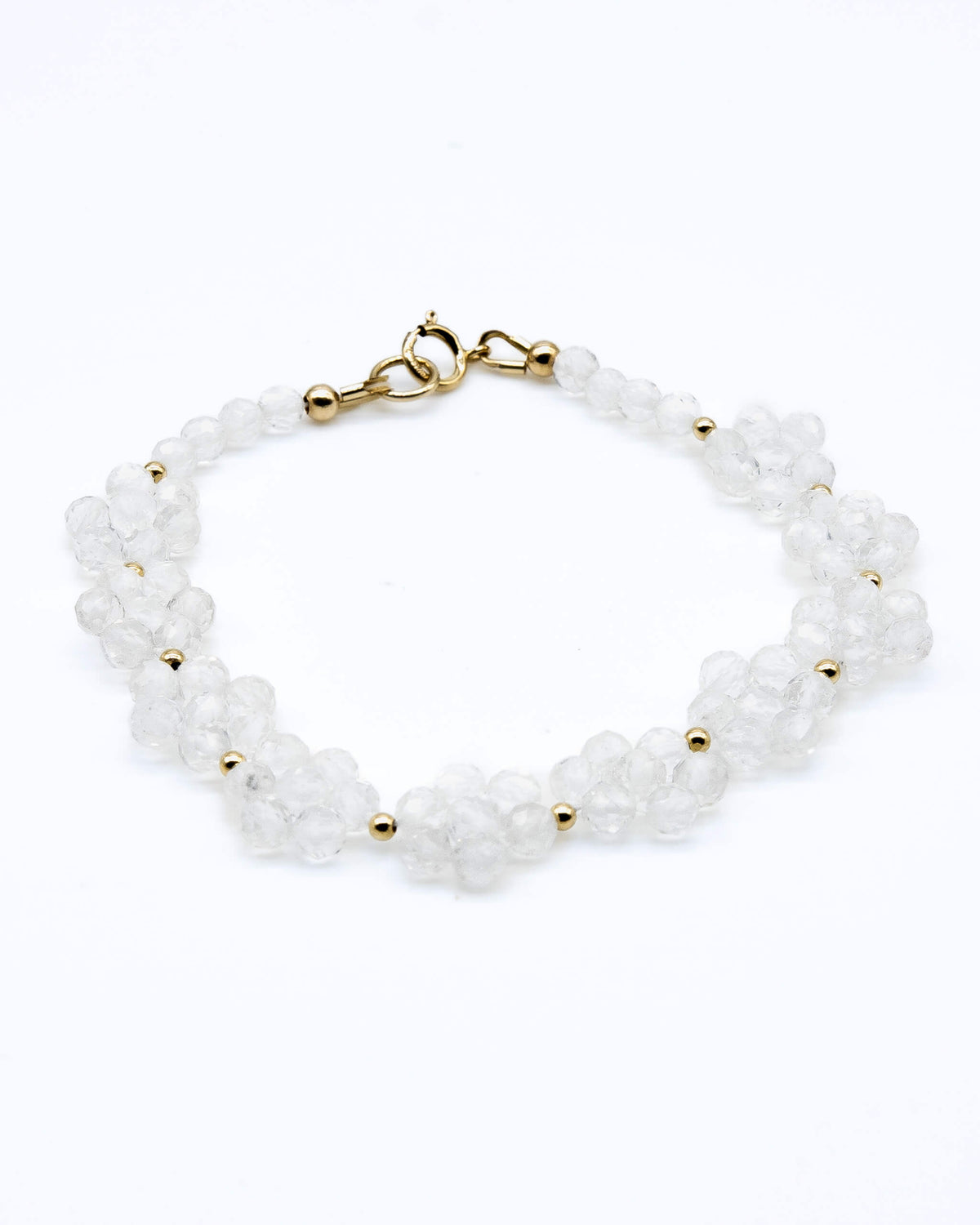 Clear quartz beaded daisy chain bracelet with 14k gold-filled details and spring ring clasp.