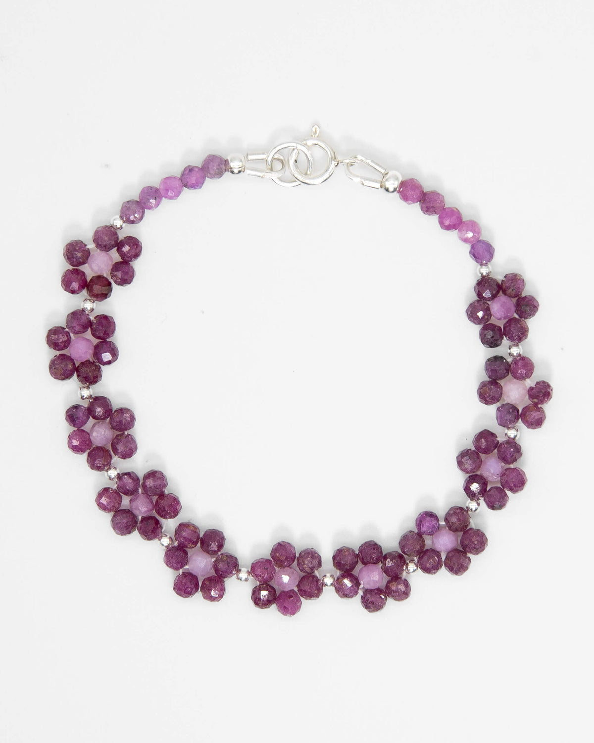 Pale and dark Ruby beaded daisy chain bracelet with sterling silver accents and spring ring clasp.