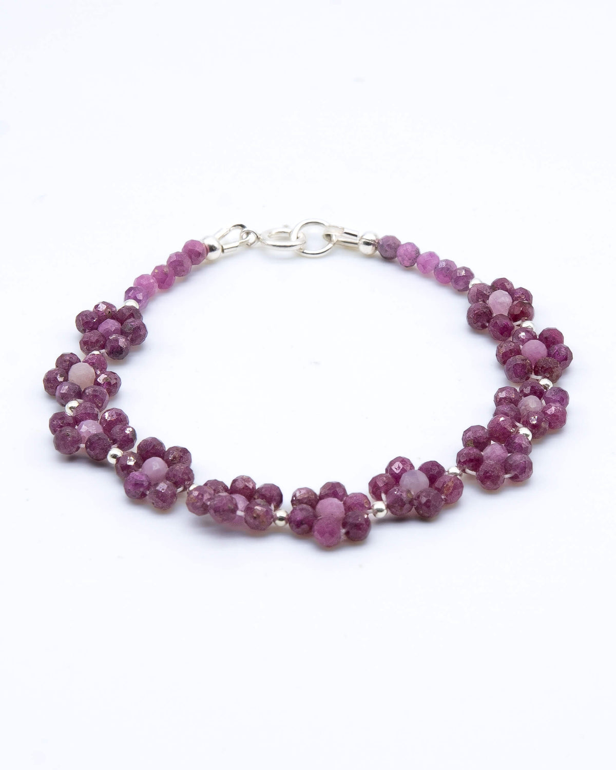 Pale and dark Ruby beaded daisy chain bracelet with sterling silver accents and spring ring clasp.