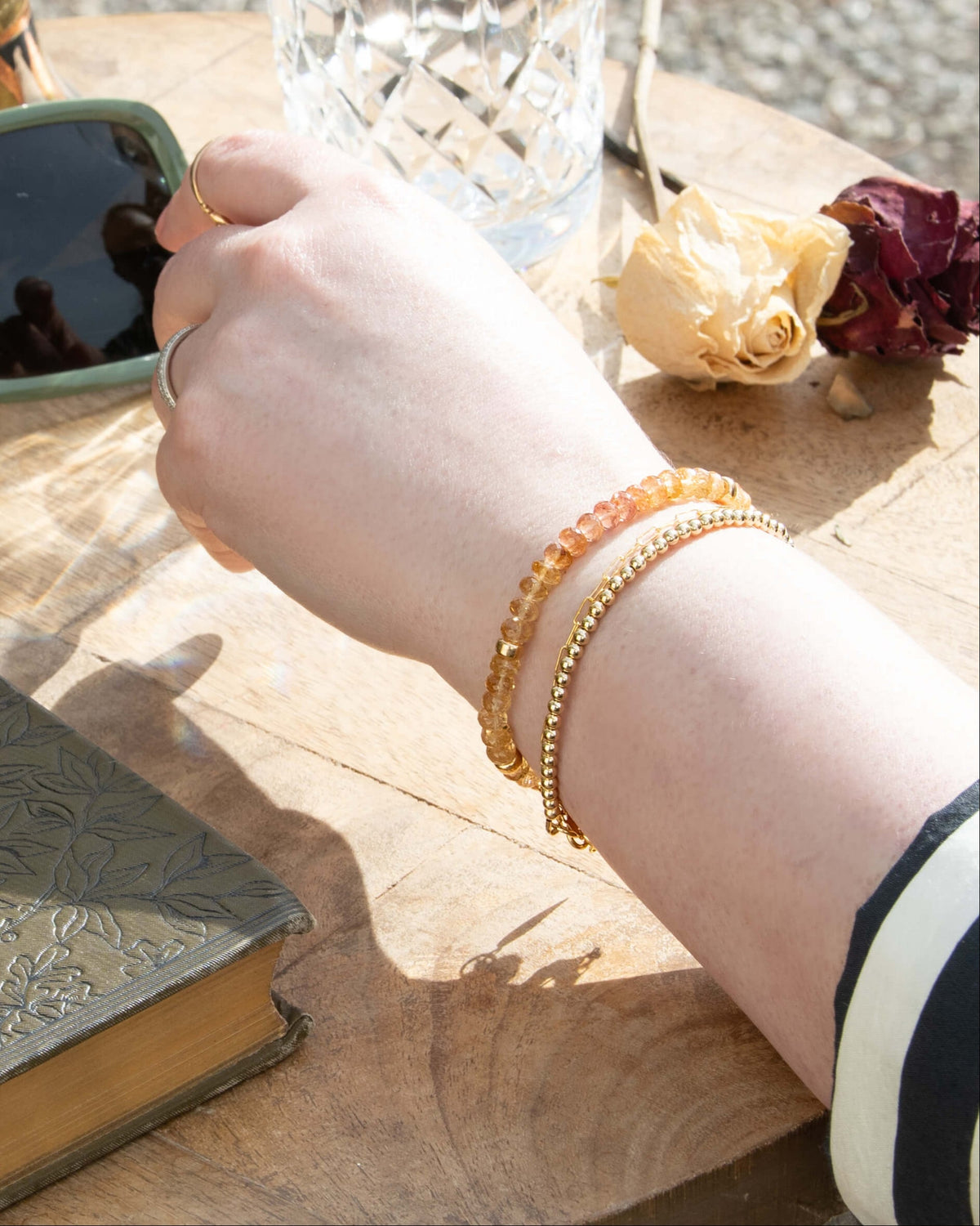 Imperial Topaz bracelet stacked on a wrist with 14k gold-filled paperclip chain, and 14k gold-filled beaded bracelet