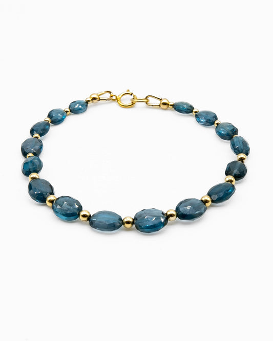 Dark blue London Topaz faceted oval-shaped beaded gemstone bracelet with 14k gold-filled accent beads and spring ring clasp