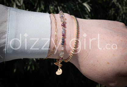 Handmade gemstone bracelet featuring ruby, sapphire, labradorite, and 14k gold-fill accent beads