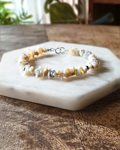 Pale off-white and grey opal chip gemstone beaded bracelet with sterling silver accent beads and spring ring clasp.
