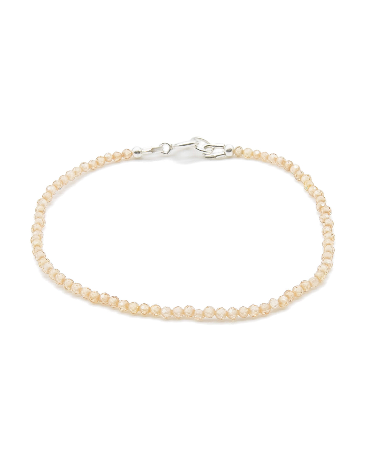Dainty peach zircon beaded gemstone bracelet with sterling silver spring ring clasp.