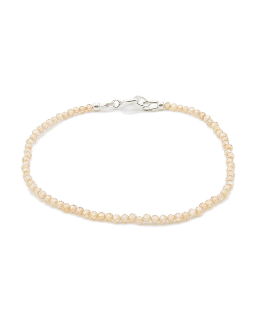 Dainty peach zircon beaded gemstone bracelet with sterling silver spring ring clasp.