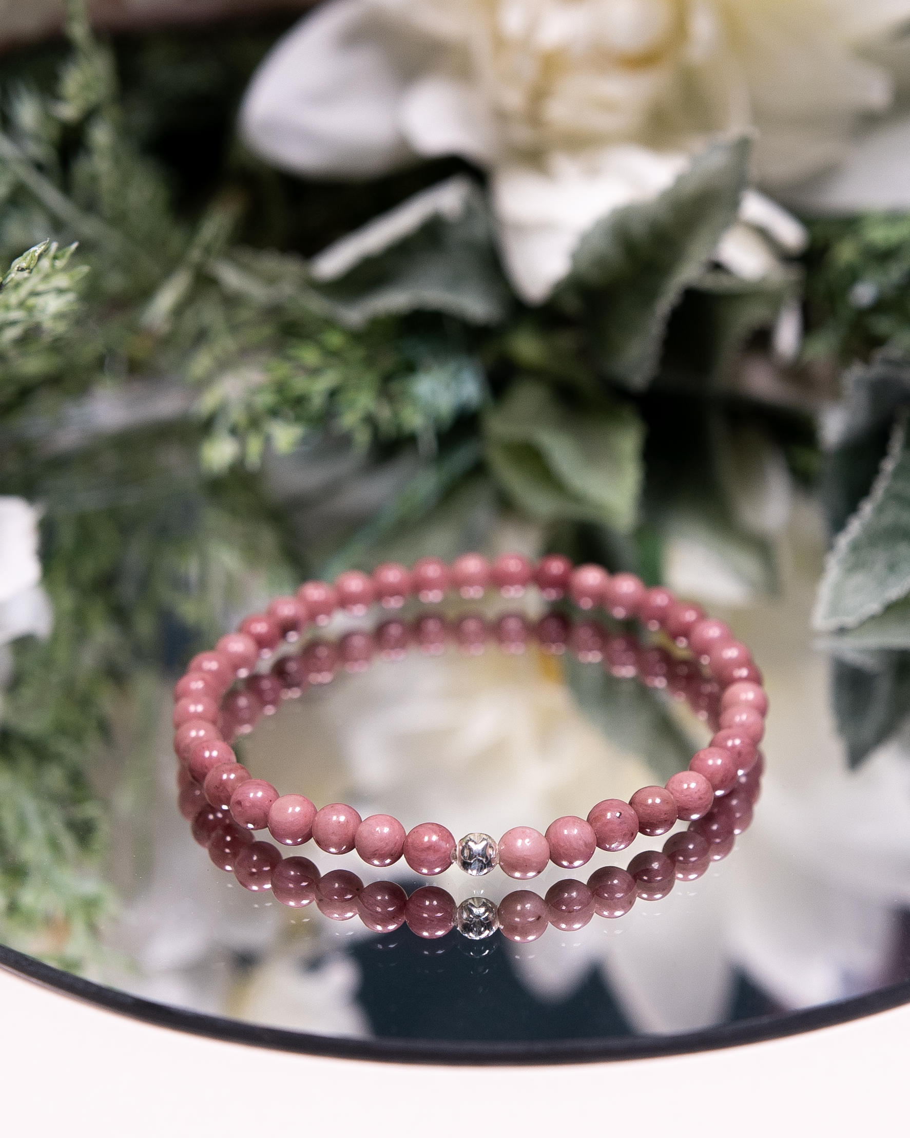 Pink Rhodonite beaded gemstone bracelet with sterling silver accent