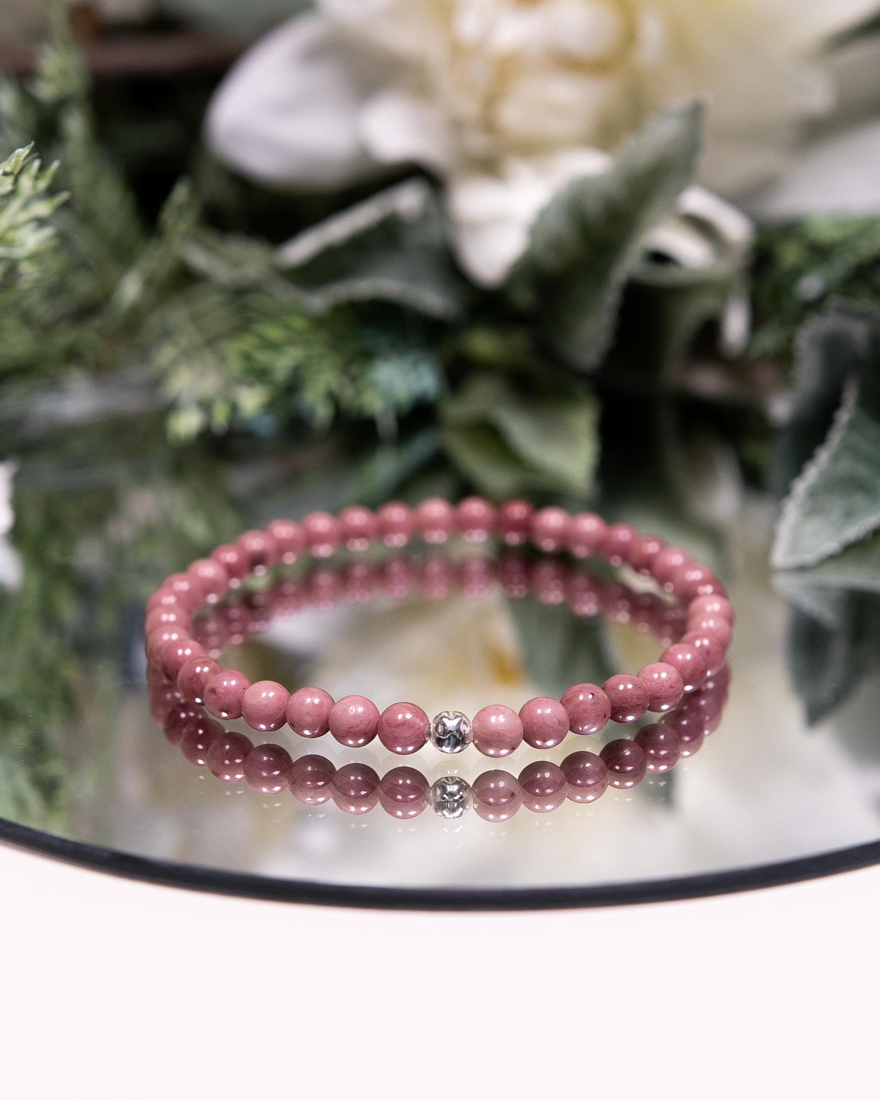 Pink Rhodonite beaded gemstone bracelet with sterling silver accent