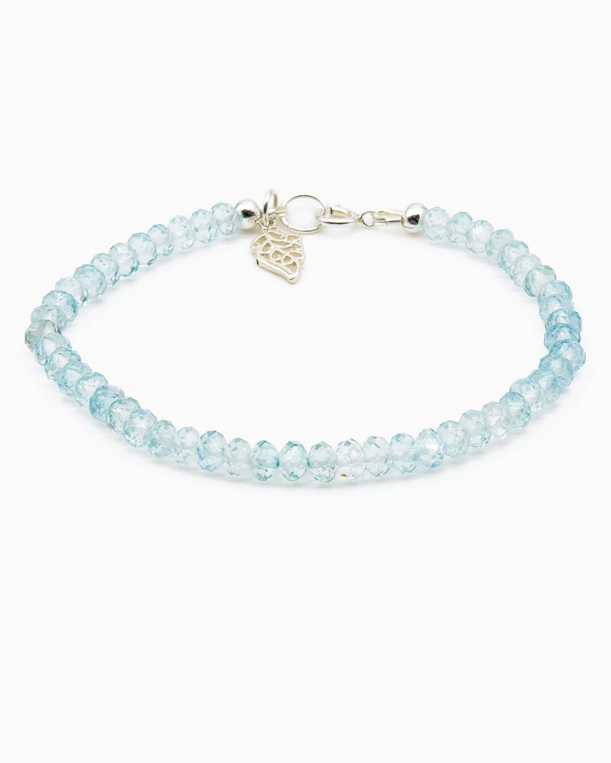 Sky blue topaz beaded gemstone bracelet with sterling silver leaf-shaped charm and spring ring clasp