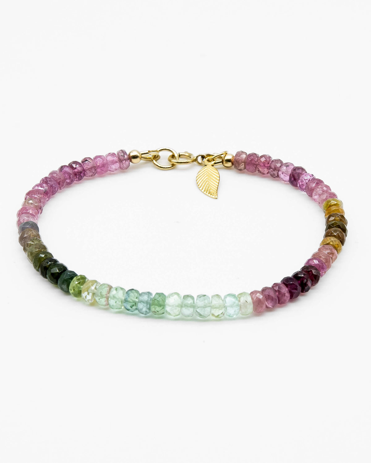 Pink, blue, green, yellow, and brown faceted tourmaline bracelet with 14k gold-filled leaf-shaped charm and spring ring clasp