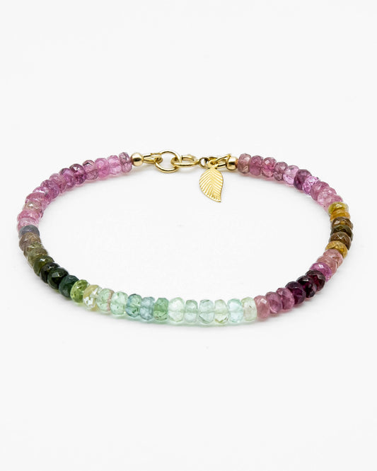 Pink, blue, green, yellow, and brown faceted tourmaline bracelet with 14k gold-filled leaf-shaped charm and spring ring clasp